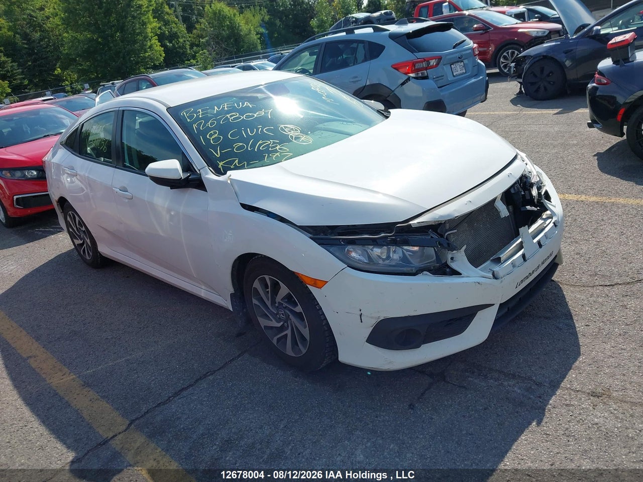 2HGFC2F61JH011256 · 2018 HONDA CIVIC SE