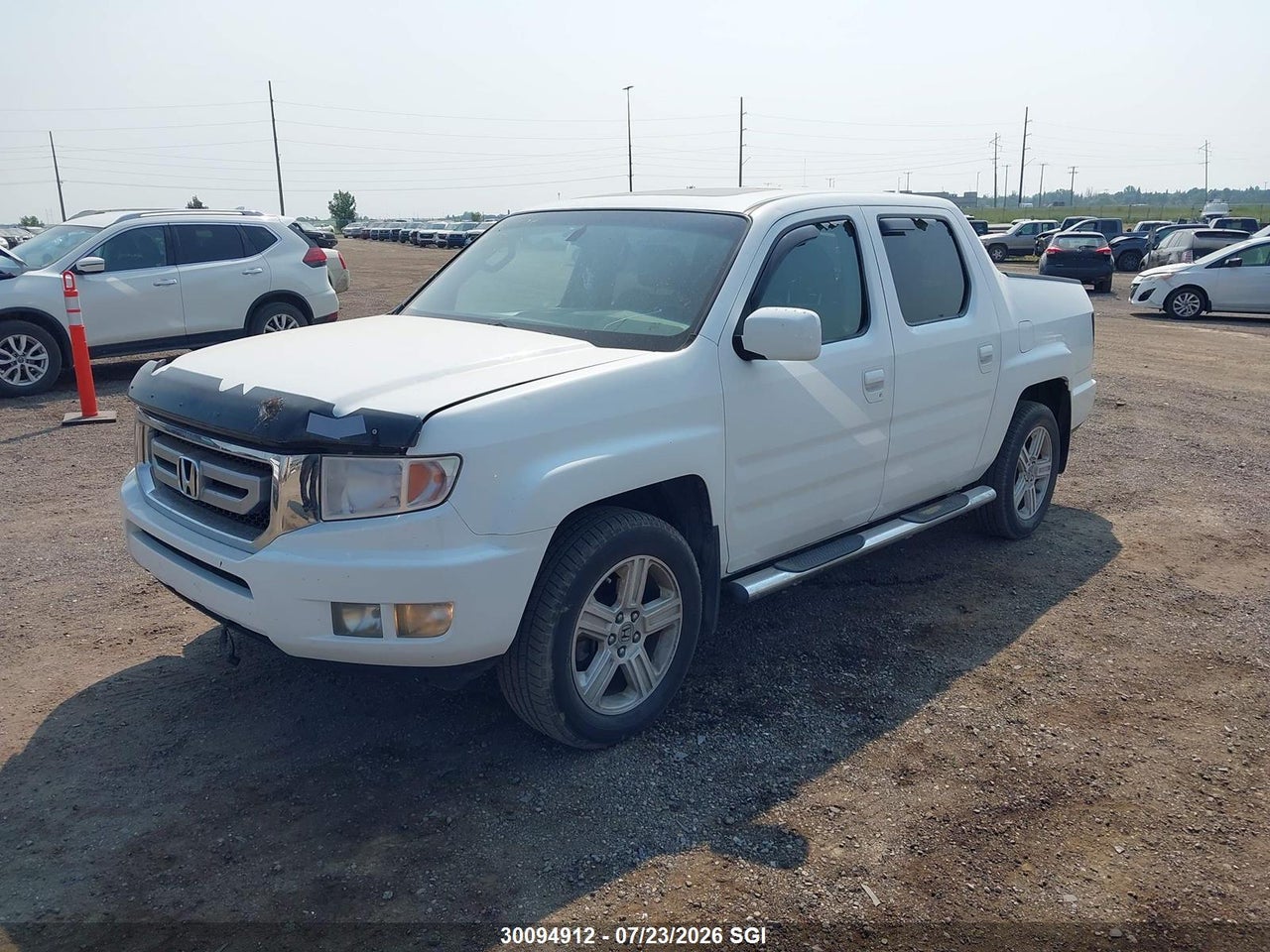 5FPYK1F52BB501957 · 2011 HONDA RIDGELINE RTL · 2/16