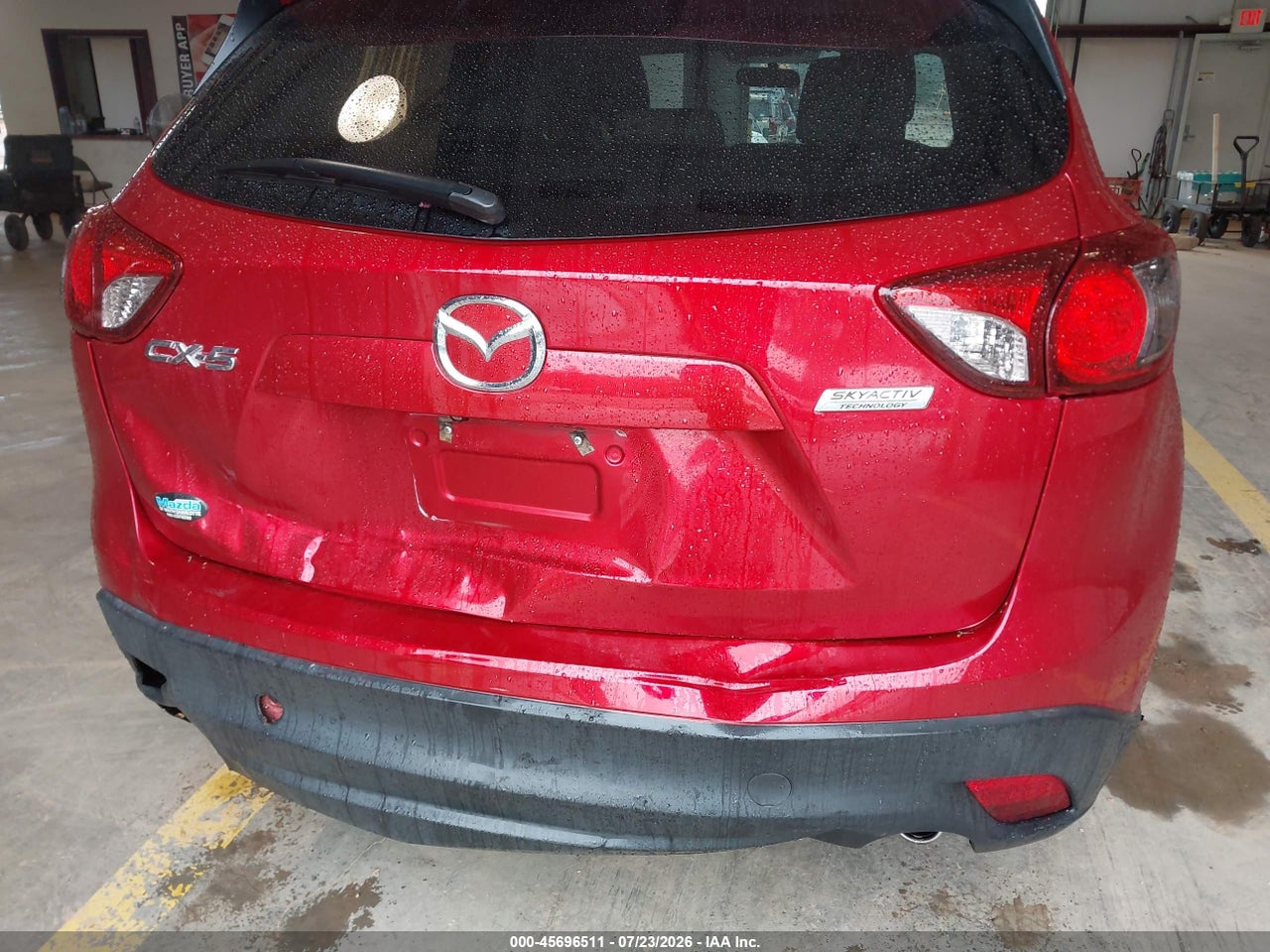 JM3KE2CY6G0****** · 2016 MAZDA CX-5 TOURING · 6/11