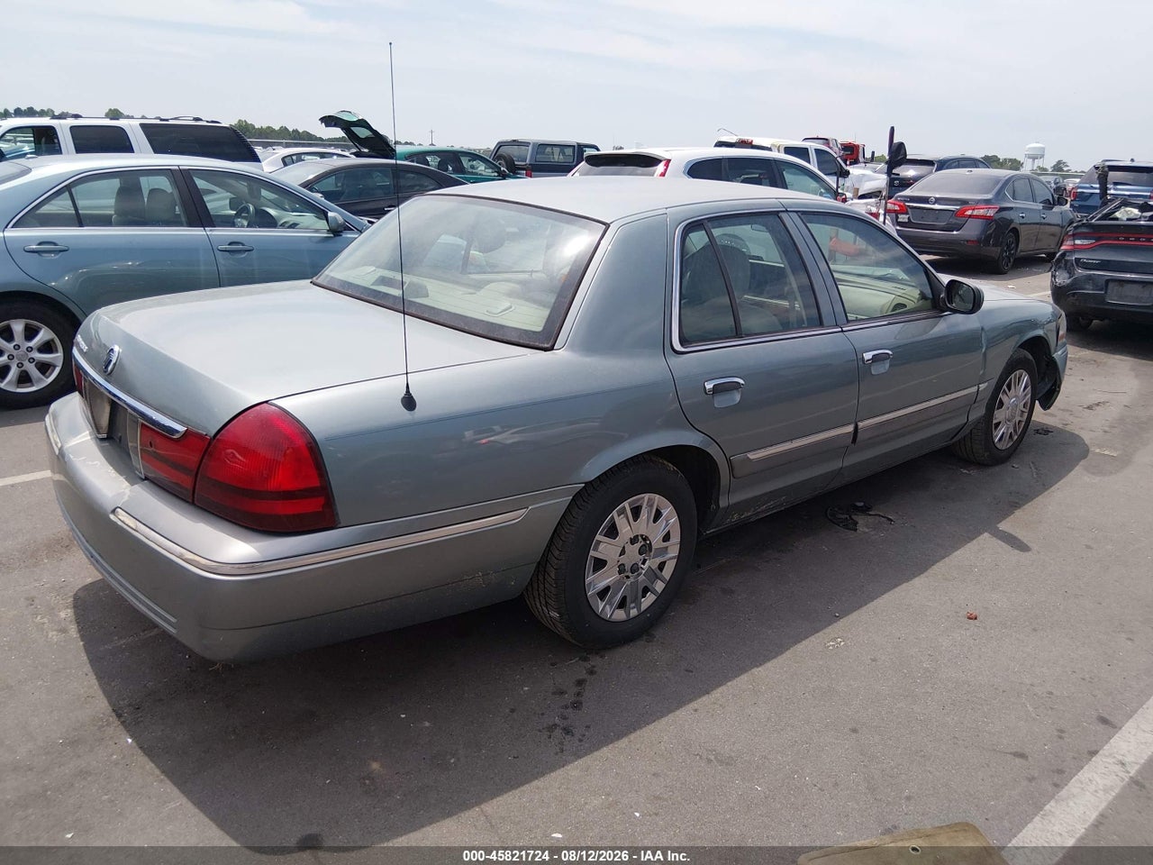 2MEFM74W55X****** · 2005 MERCURY GRAND MARQUIS GS · 4/6