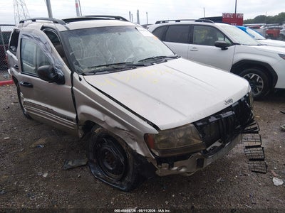 1J4GW48SX4C****** · 2004 JEEP GRAND CHEROKEE LAREDO