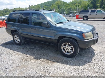 1J4GW48S04C****** · 2004 JEEP GRAND CHEROKEE LAREDO
