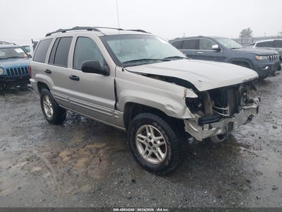 1J4GW48SX4C****** · 2004 JEEP GRAND CHEROKEE LAREDO