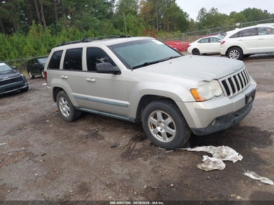 1J8GS48K49C****** · 2009 JEEP GRAND CHEROKEE LAREDO