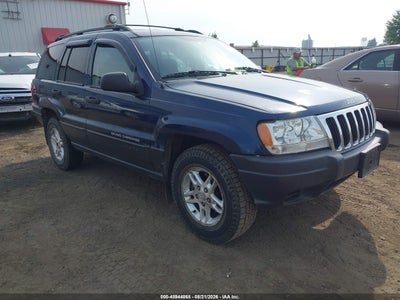 1J4GW48S93C****** · 2003 JEEP GRAND CHEROKEE LAREDO