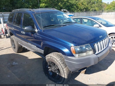 1J4GW48S84C****** · 2004 JEEP GRAND CHEROKEE LAREDO