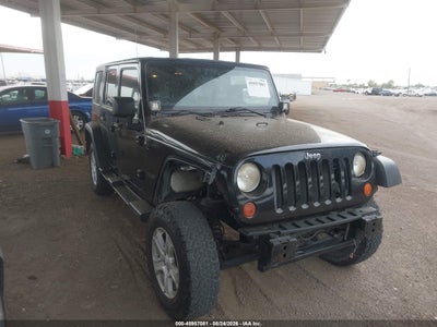 1J4BA6H12BL****** · 2011 JEEP WRANGLER UNLIMITED RUBICON